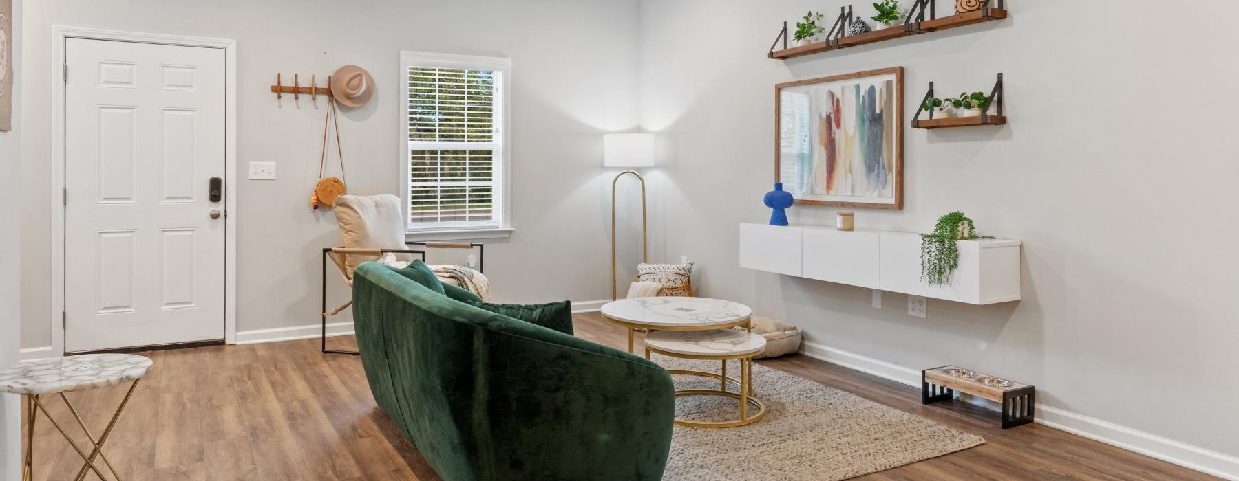 a living room with a green couch