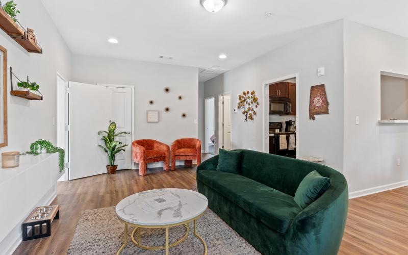 a living room with a green couch